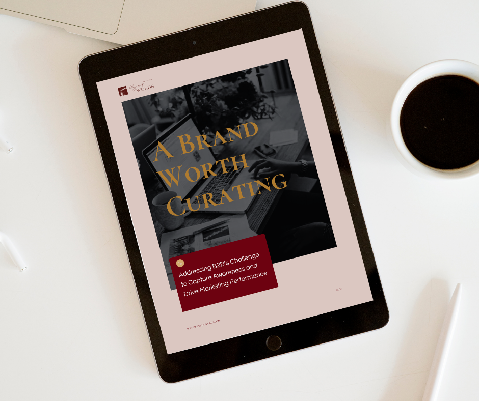 iPad on table next to coffee, displaying the cover of an ebook titled "A Brand Worth Curating"